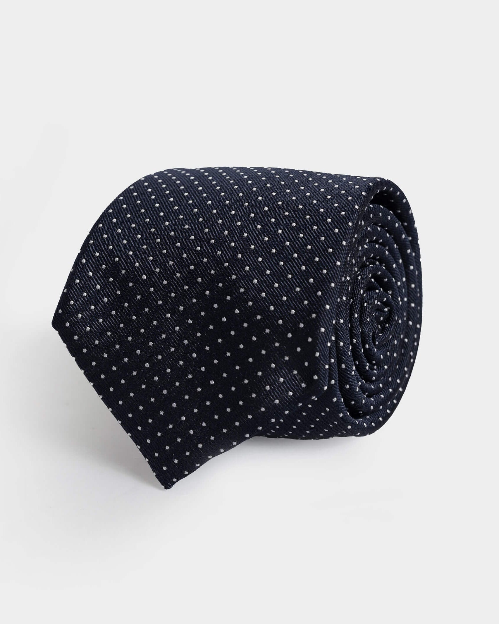 Navy Basso 100% silk jacquard tie with small-scale white dots — made in Italy by Ledbury