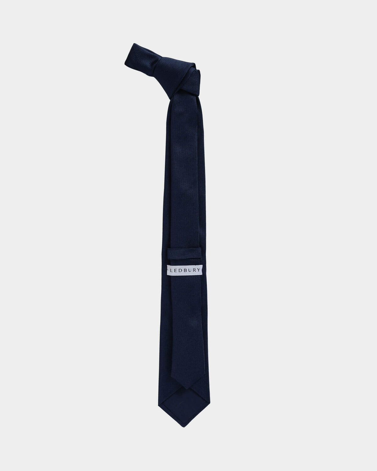 Full length back view of the Navy Barone silk tie — modern width by Ledbury
