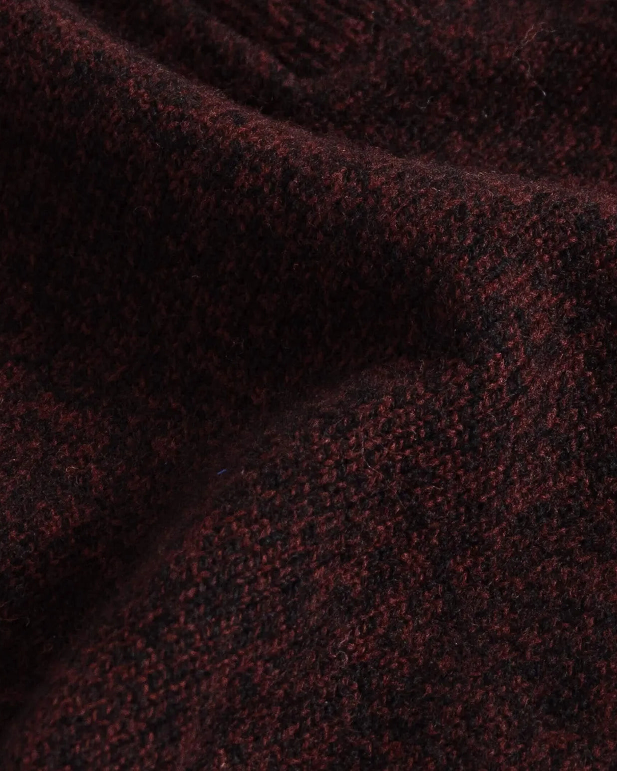 Close-up of dark burgundy superfine merino wool knit texture on the Brewer Mock Neck Sweater