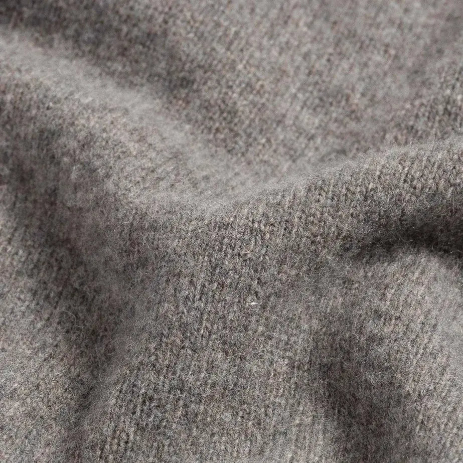 Close-up of 90% merino wool 10% cashmere fabric on the Seal Heather Ashton quarter-zip sweater