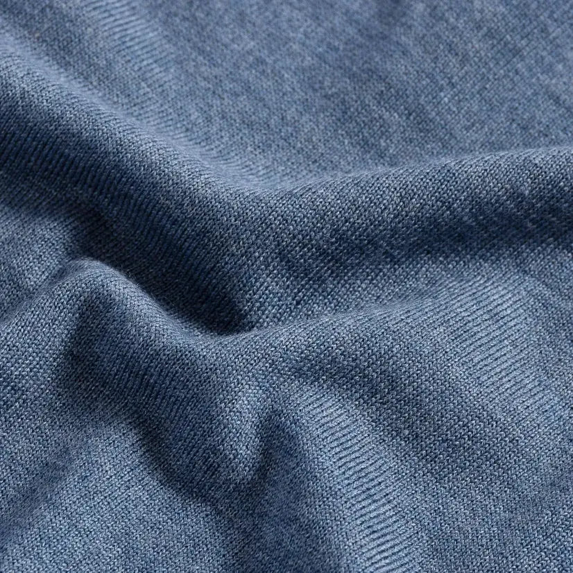 Close-up of 100% extrafine wool fabric on the Blue Heather Emmons V-neck sweater