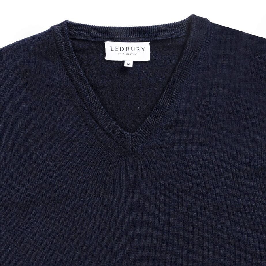 Rib-knit V-neck and cuff detail on the Navy Emmons sweater by Ledbury