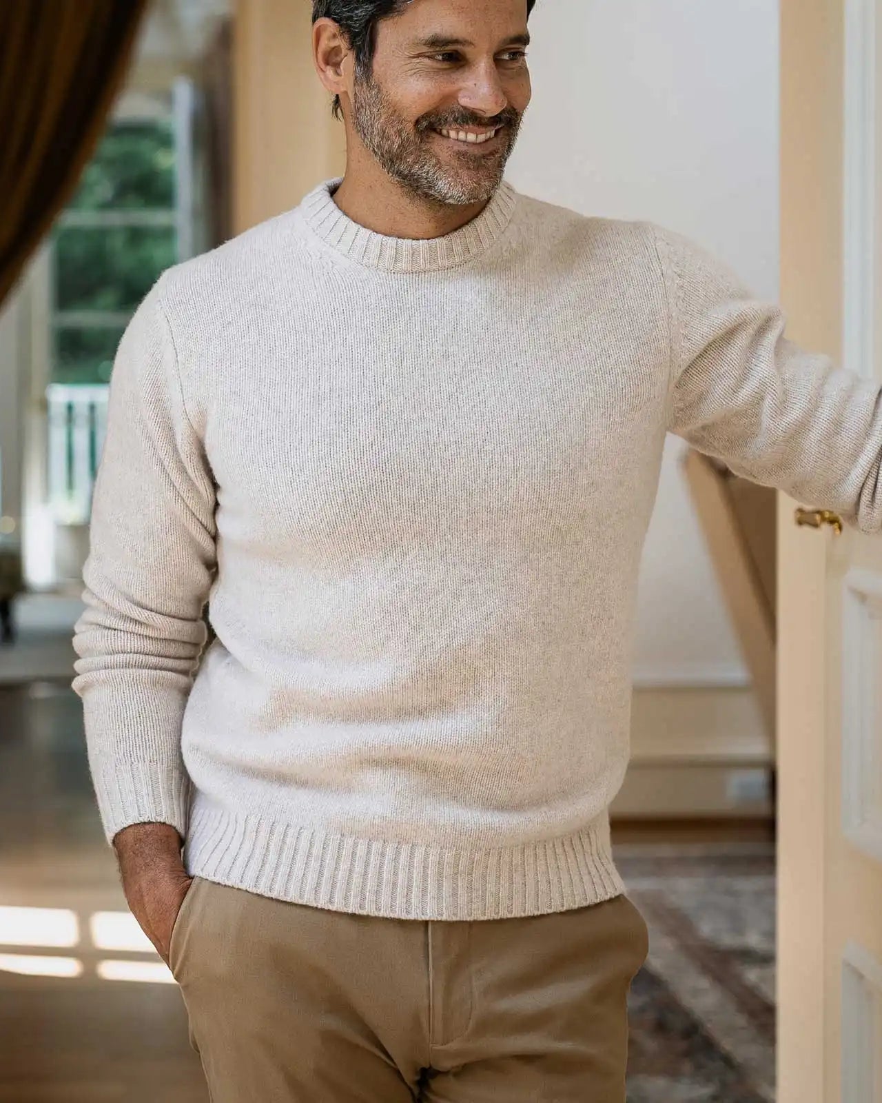 Men's Beige Boden Crew sweater styled with chinos — lifestyle shot