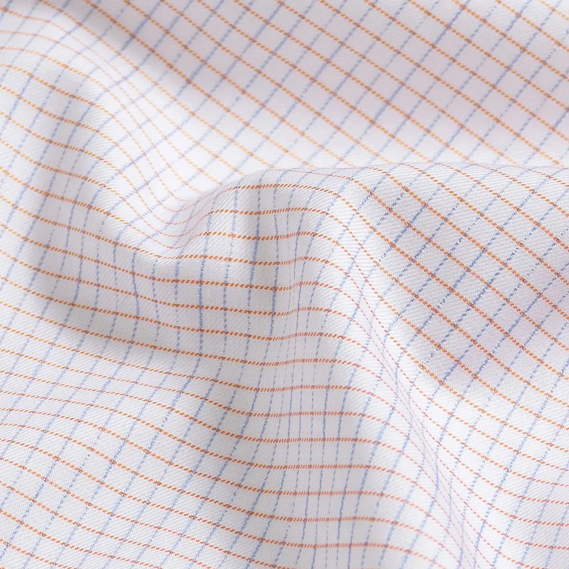 Apricot check fabric close-up - Ledbury Kentland twill with blue and orange floating yarns