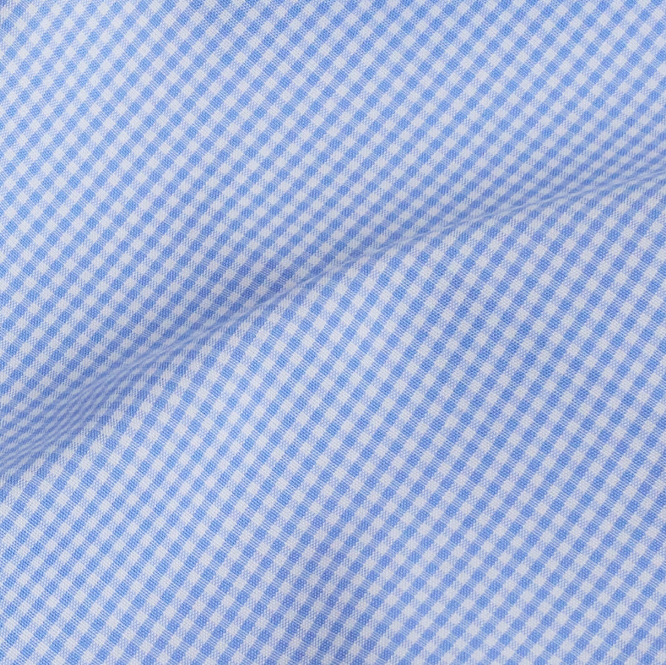 Premium blue micro gingham fabric close-up - subtle luxury dress shirt pattern