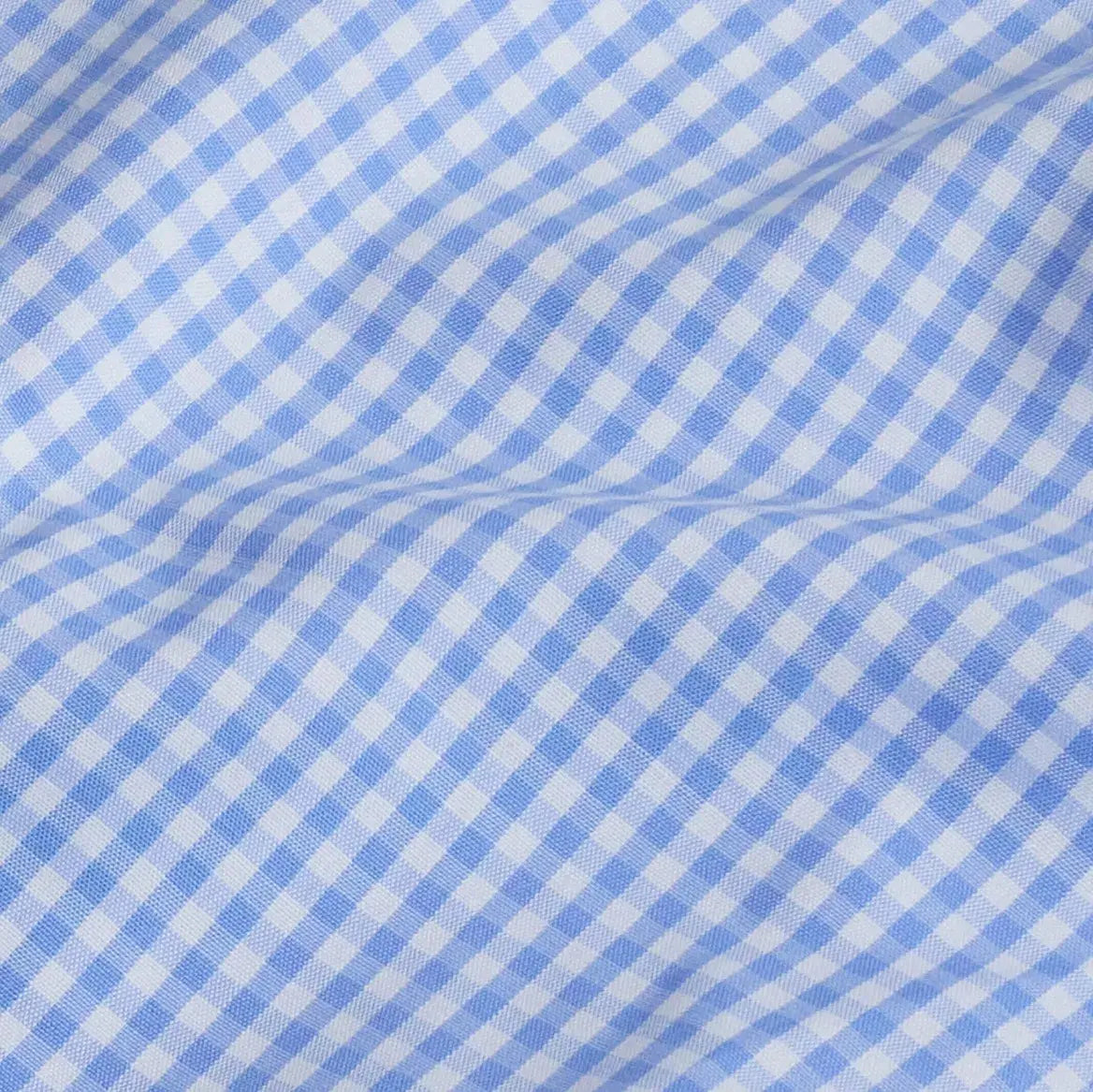 Blue and white gingham fabric close-up - classic dress shirt pattern