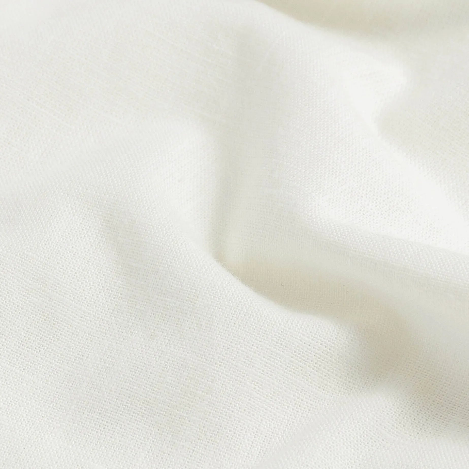Cream oxford chambray slub cotton fabric texture detail, naturally broken-in feel | Ledbury