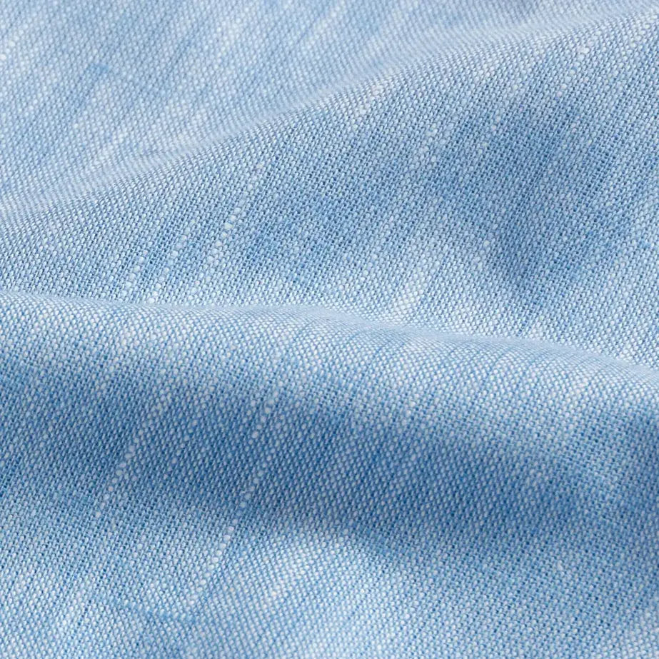 Light blue Sandoval oxford chambray shirt fabric texture closeup - Ledbury slub cotton weave detail