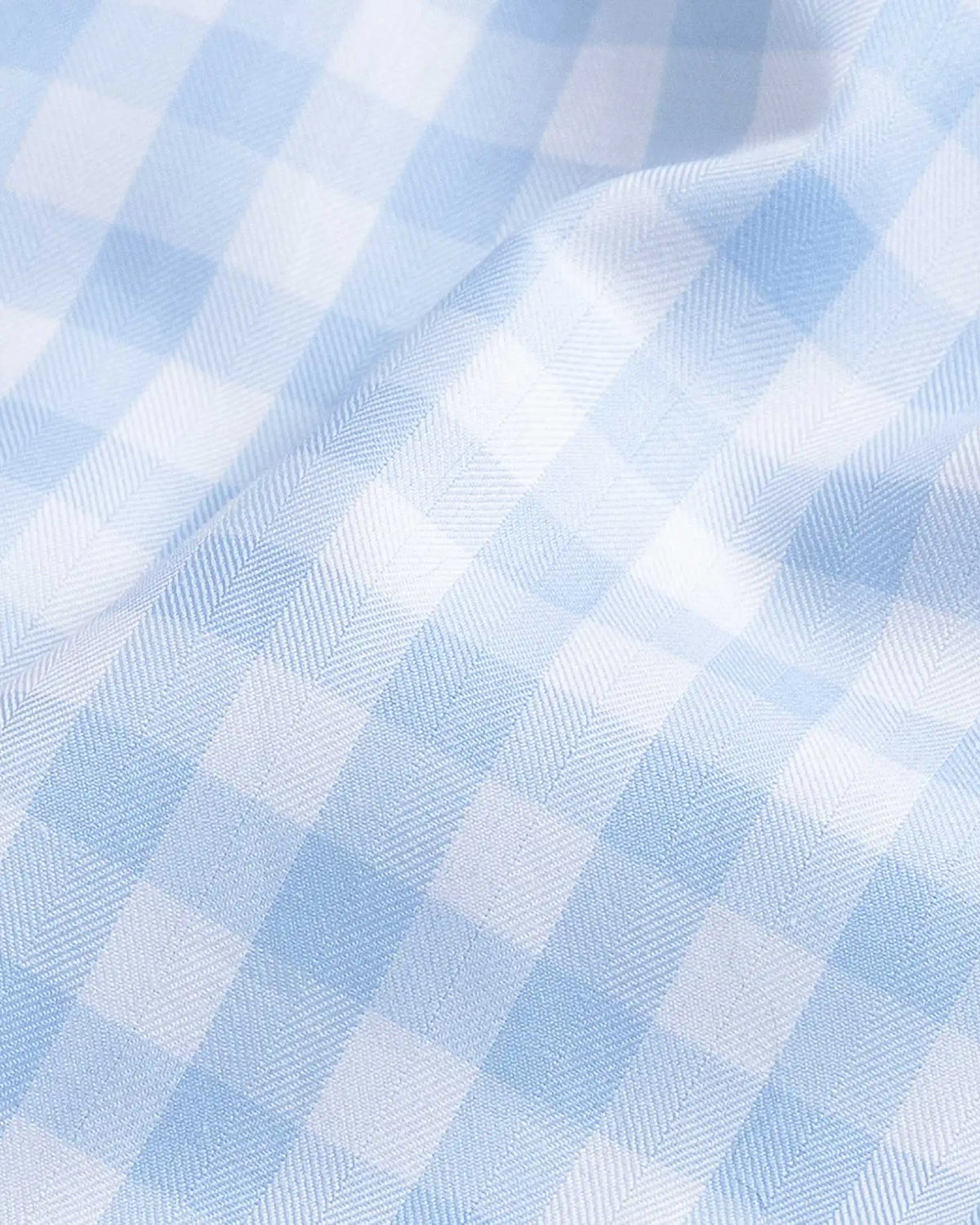 Gingham check fine twill fabric close-up - light blue classic pattern texture