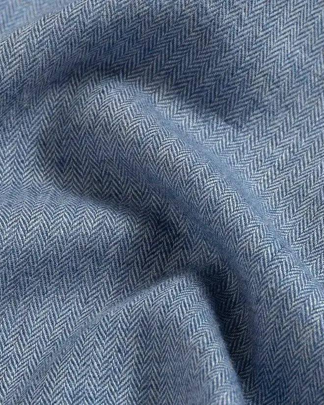 Close-up of blue herringbone fabric texture
