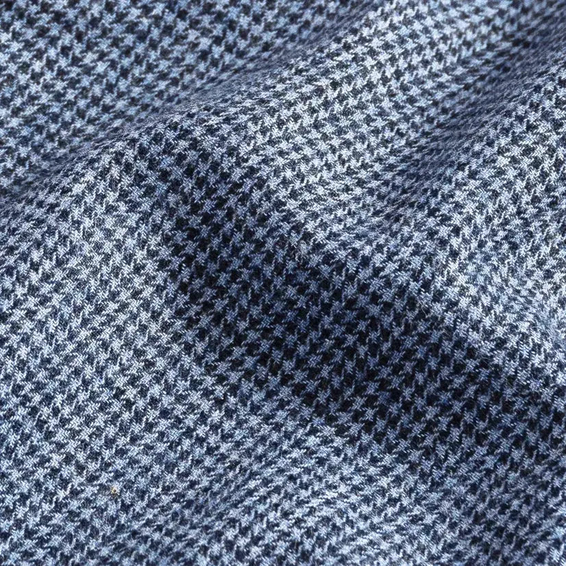 Brushed twill fabric close-up - blue houndstooth pattern texture
