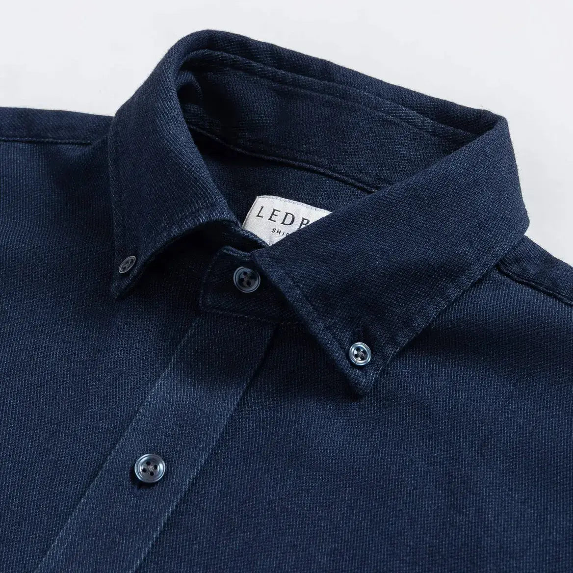 Indigo denim shirt button-down collar detail - 100% cotton construction