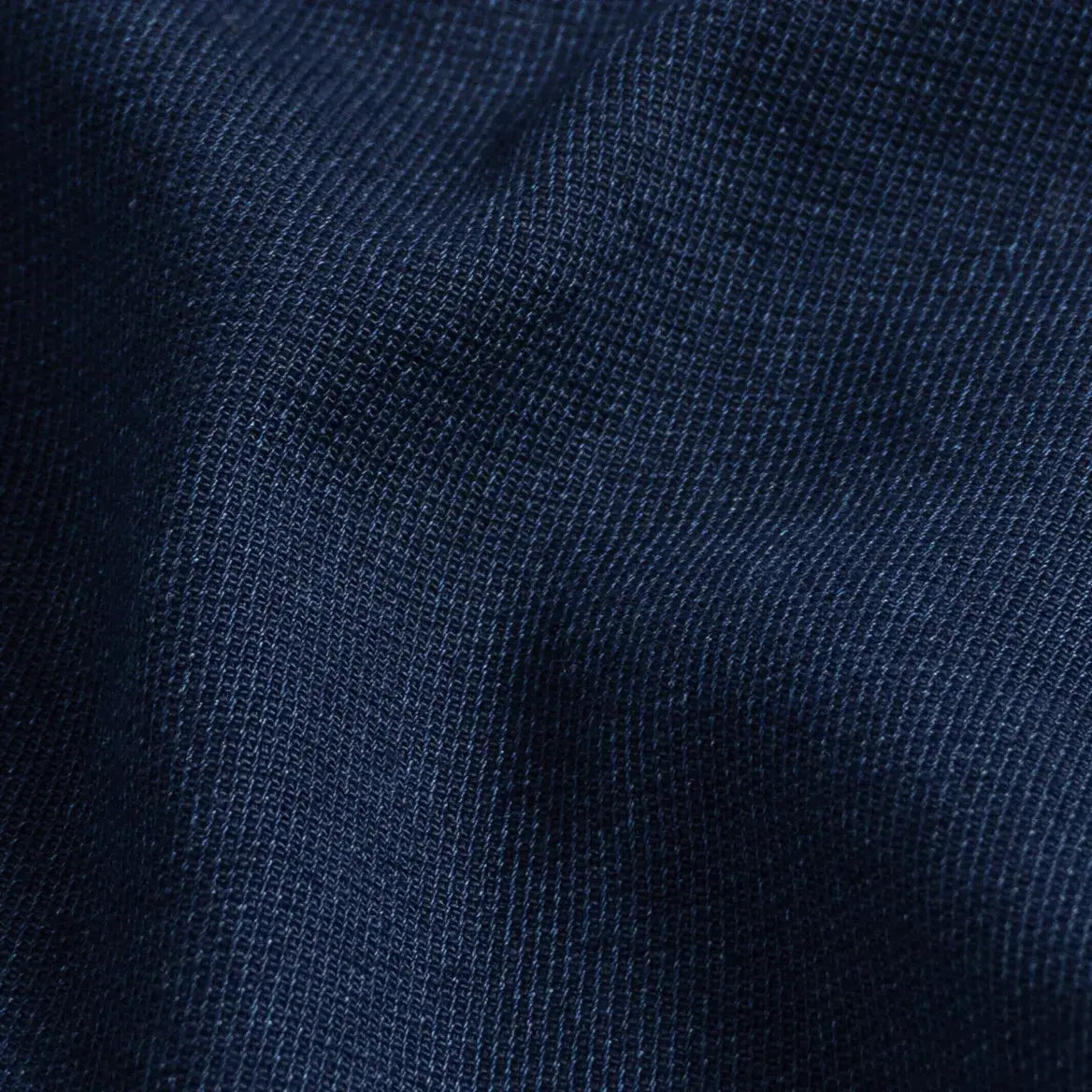 Indigo Lisden denim fabric close-up - natural indigo dobby weave texture