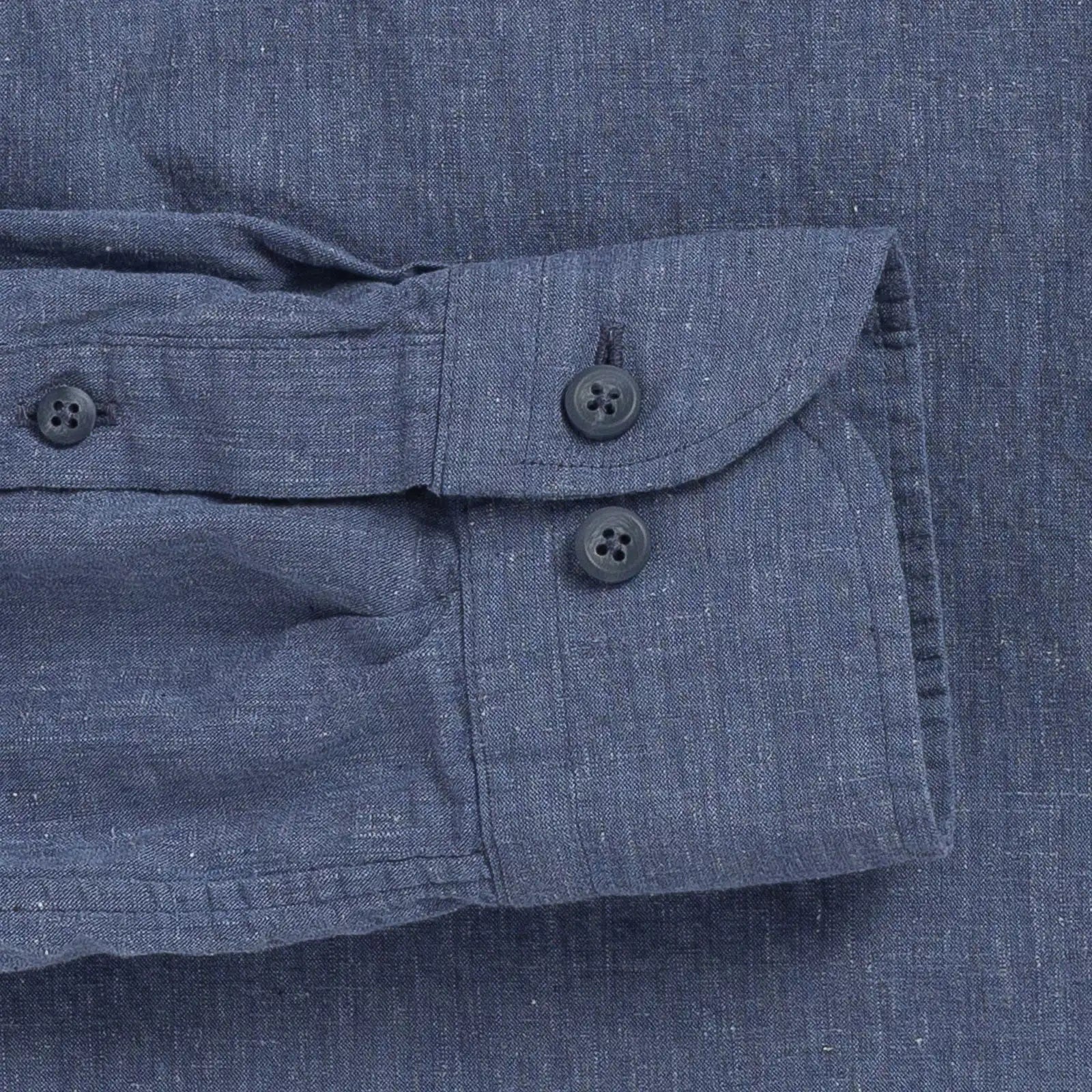 Double button barrel cuff detail on a blue cotton/linen shirt by Ledbury