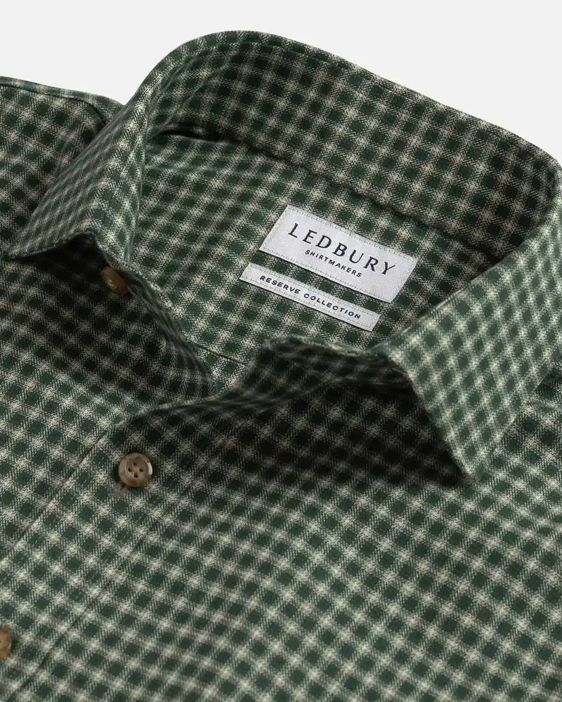 Close-up of a green and white checkered button-down shirt collar with a visible LEDBURY brand label.