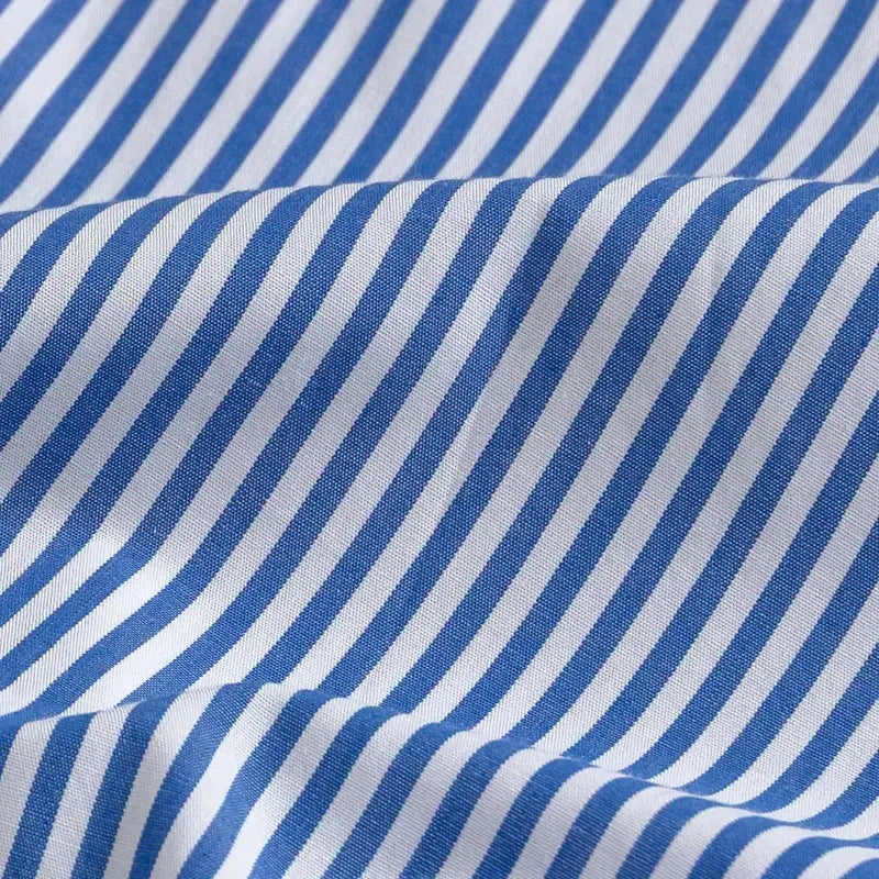 Blue and white striped fabric with a diagonal stripe pattern, shown with soft folds and texture.