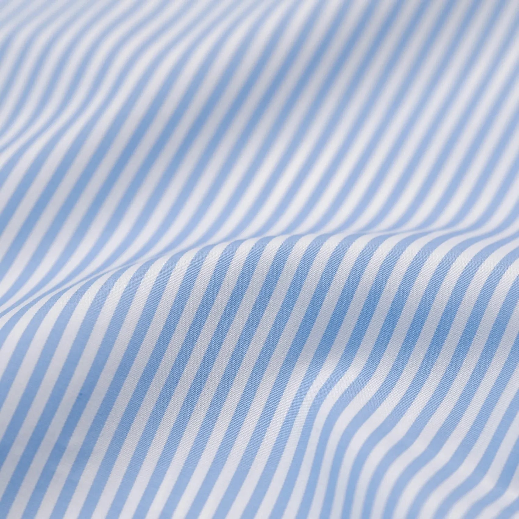 Blue vertical stripe fabric close-up - perennial dress shirt pattern