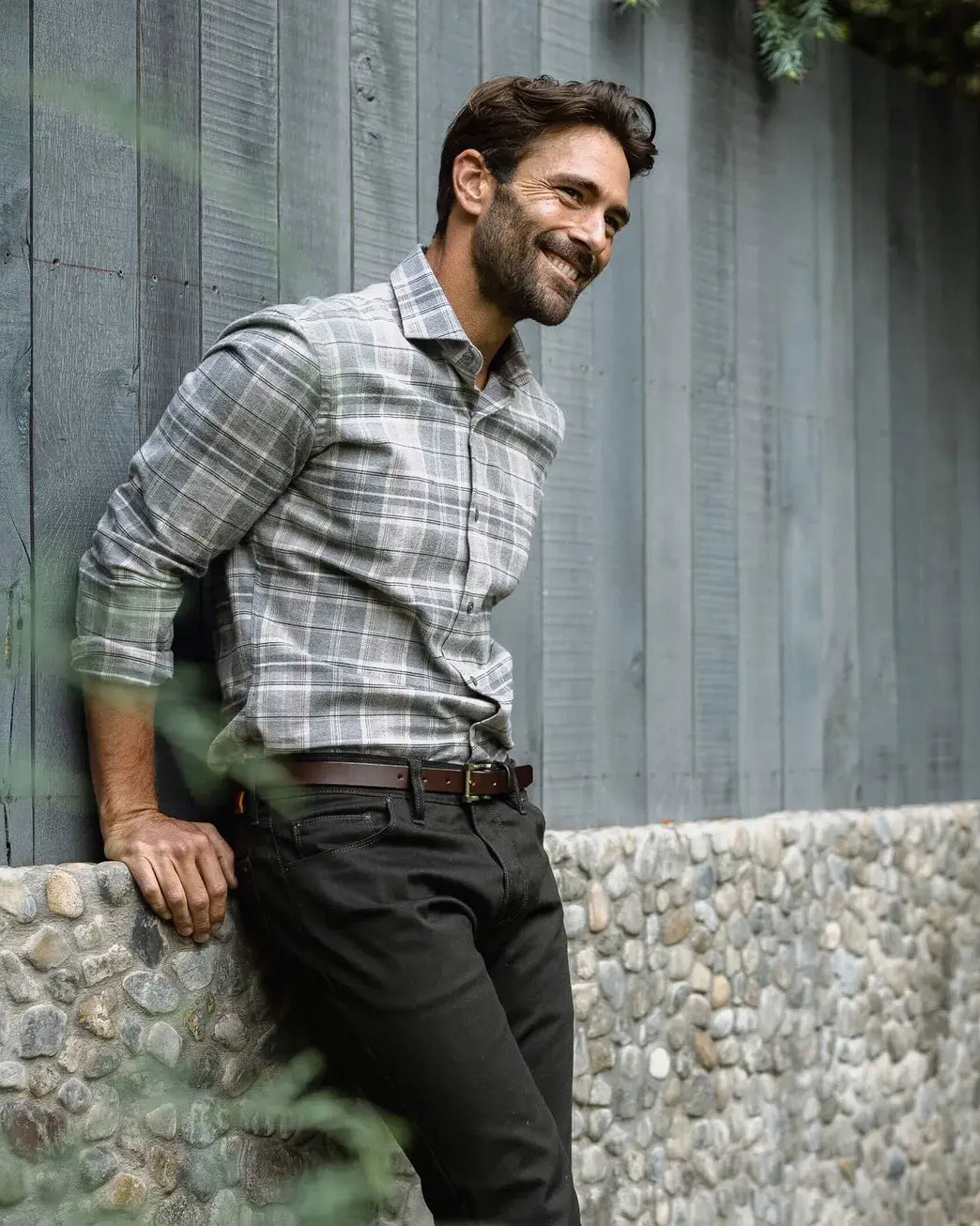 Man wearing Light Grey Callisto Plaid flannel shirt in an outdoor setting - casual lifestyle photo