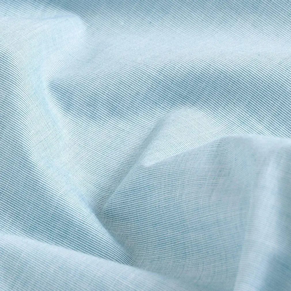 Green chambray fabric close-up texture - 100% cotton Hucks shirt weave