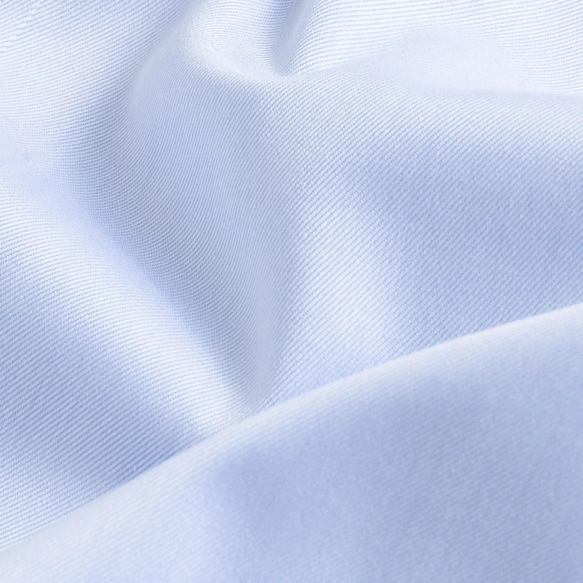 Non-iron fine twill fabric in light blue - wrinkle-resistant cotton texture
