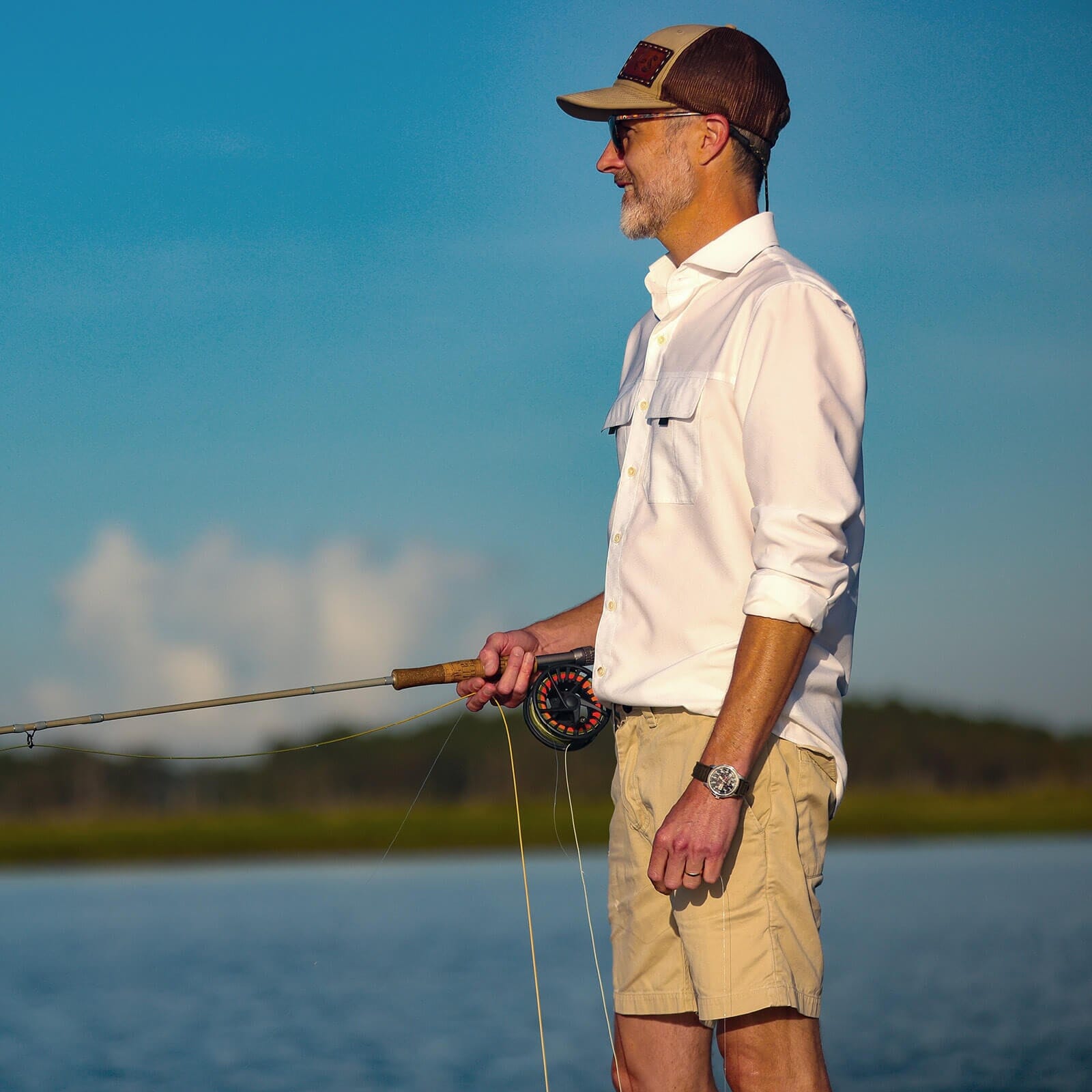 Man wearing white Tulu fishing shirt outdoors - Ledbury performance casual wear lifestyle
