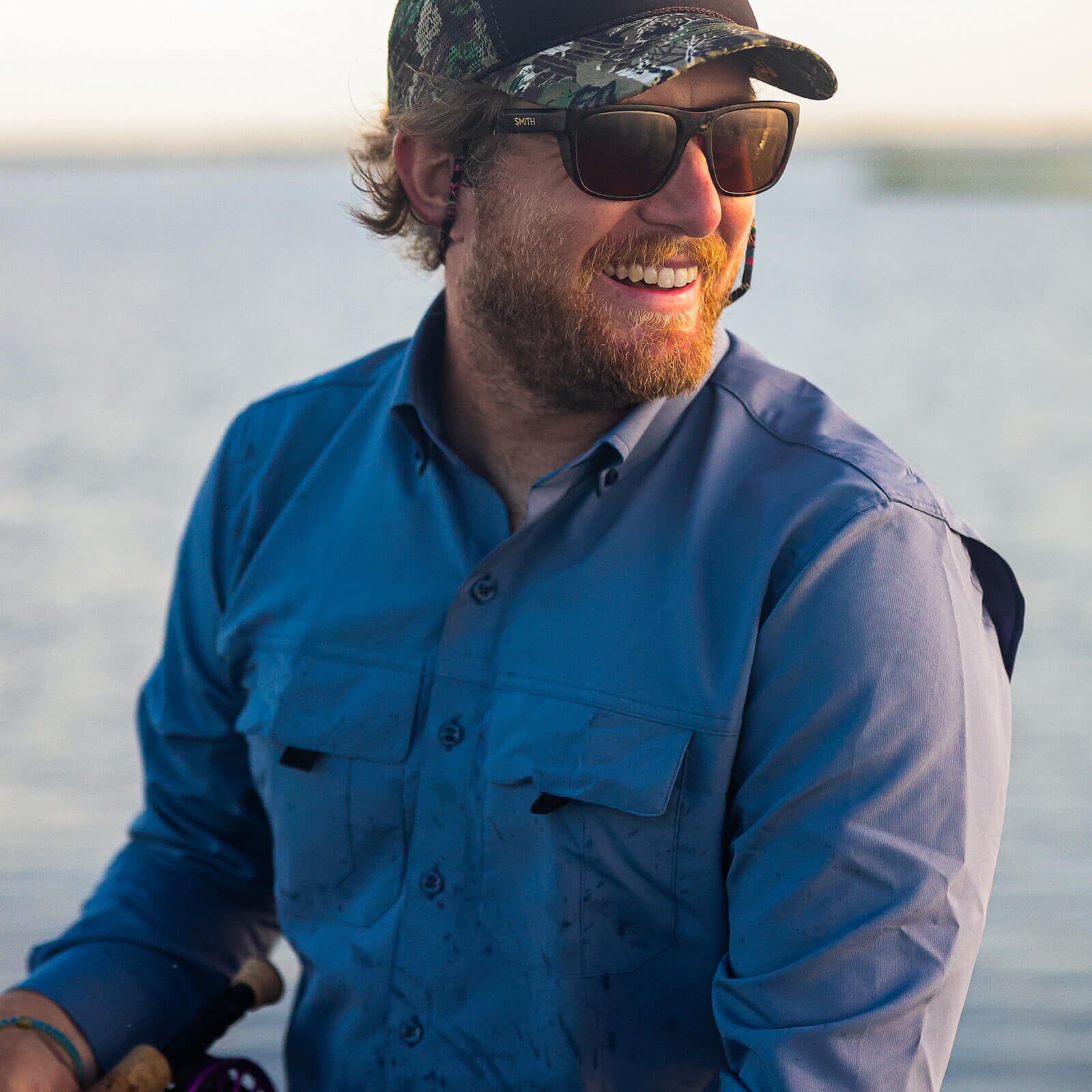 Man wearing blue Tulu fishing shirt lifestyle - Ledbury performance outdoor shirt