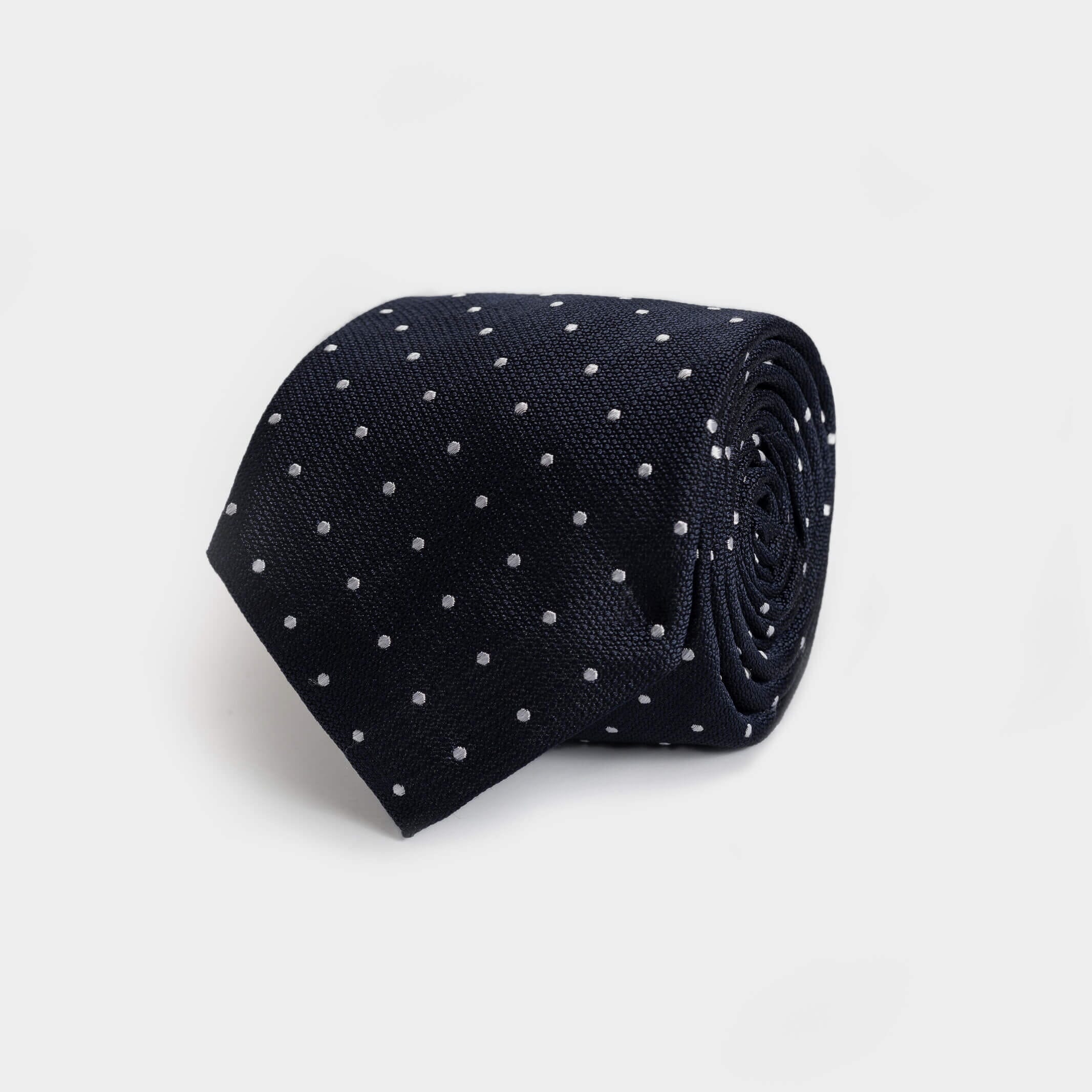 Navy Sarto 100% silk jacquard tie with white dot pattern — made in Italy by Ledbury