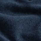 Close-up of blue heather superfine merino wool knit texture on the Brewer Mock Neck Sweater
