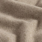 Close-up of camel heather superfine merino wool knit texture on the Brewer Mock Neck Sweater