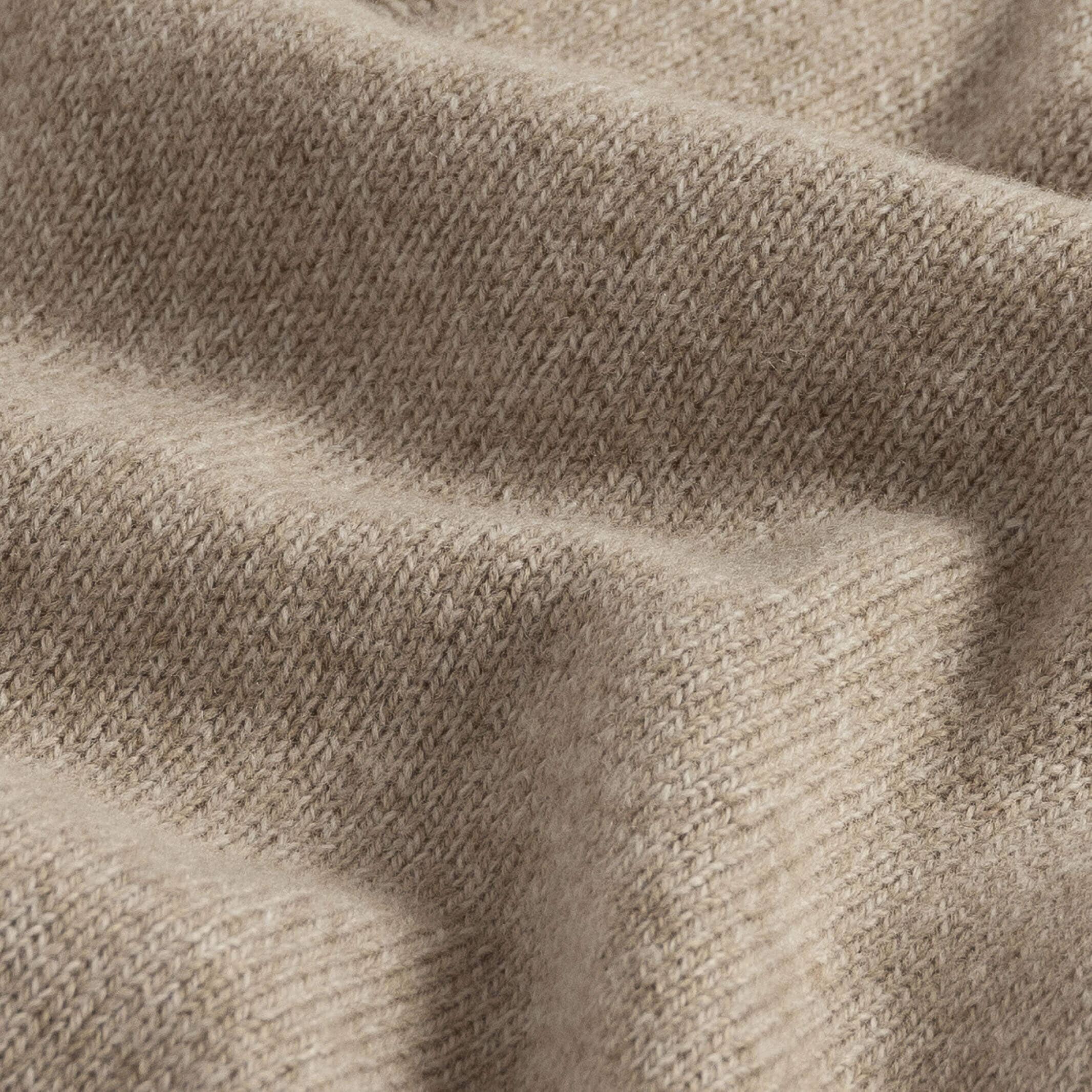 Close-up of camel heather superfine merino wool knit texture on the Brewer Mock Neck Sweater