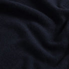 Close-up of 90% merino wool 10% cashmere fabric on the Navy Ashton quarter-zip sweater by Ledbury