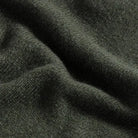 Close-up of 90% merino wool 10% cashmere fabric on the Forest Ashton quarter-zip sweater
