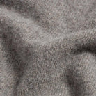 Close-up of 90% merino wool 10% cashmere fabric on the Seal Heather Ashton quarter-zip sweater
