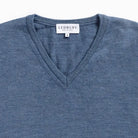 Rib-knit V-neck and cuff detail on the Blue Heather Emmons sweater by Ledbury