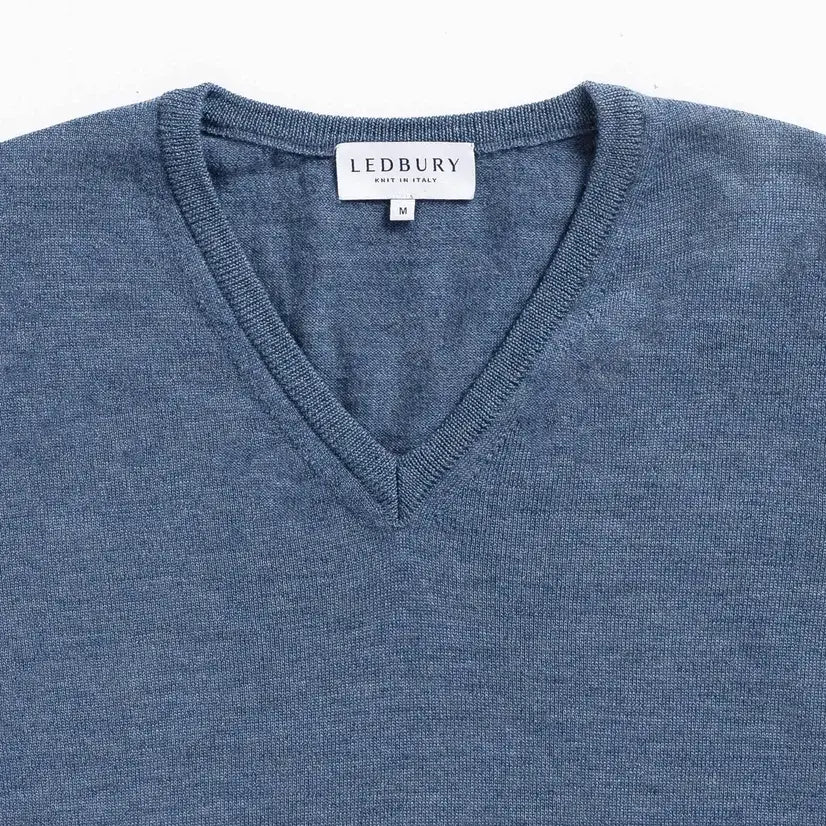 Rib-knit V-neck and cuff detail on the Blue Heather Emmons sweater by Ledbury