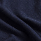 Close-up of 100% extrafine wool fabric on the Navy Emmons V-neck sweater