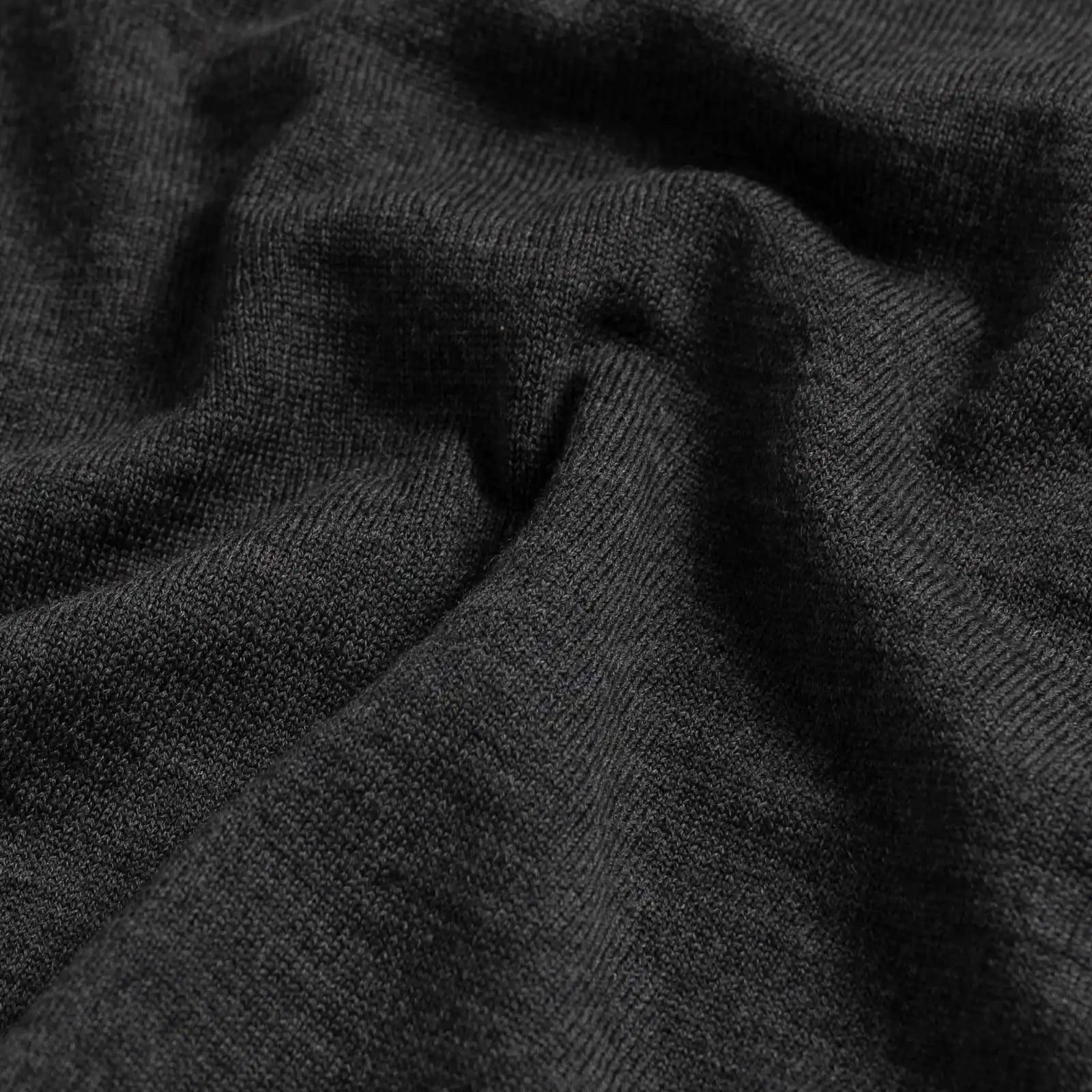Close-up of 100% extrafine wool fabric on the Charcoal Heather Emmons V-neck sweater
