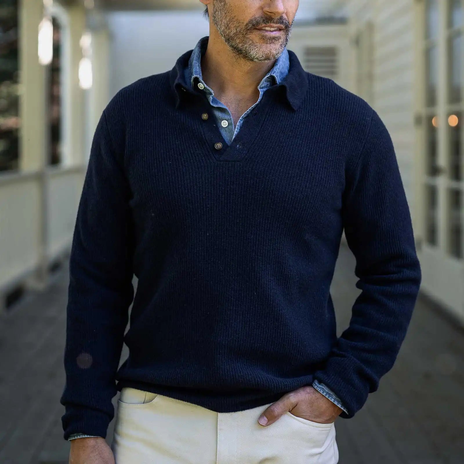 Men's Navy Atwood polo sweater styled with chinos — lifestyle shot
