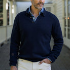 Men's Navy Atwood polo sweater styled with chinos — lifestyle shot