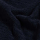 Close-up of 12gg rib wool blend fabric on the Navy Atwood knit collar sweater