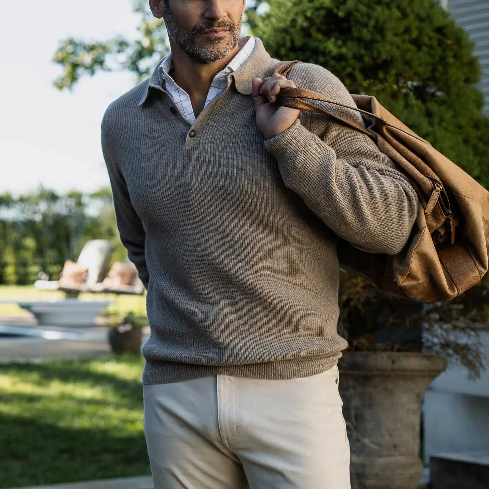 Men's Soft Brown Atwood polo sweater styled with chinos — lifestyle shot