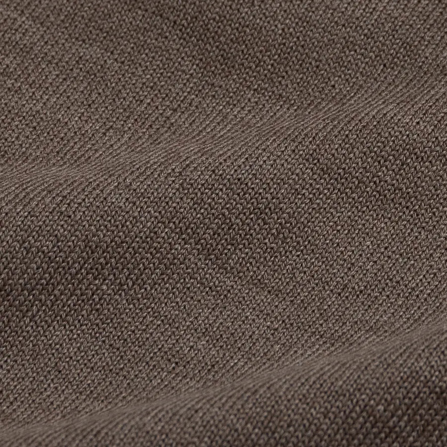 A close-up of a textured knit fabric in a dark taupe-brown color, showing the detailed weave and soft folds.