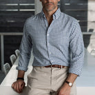 Light blue Farwell Gingham custom shirt worn with beige chinos — Ledbury