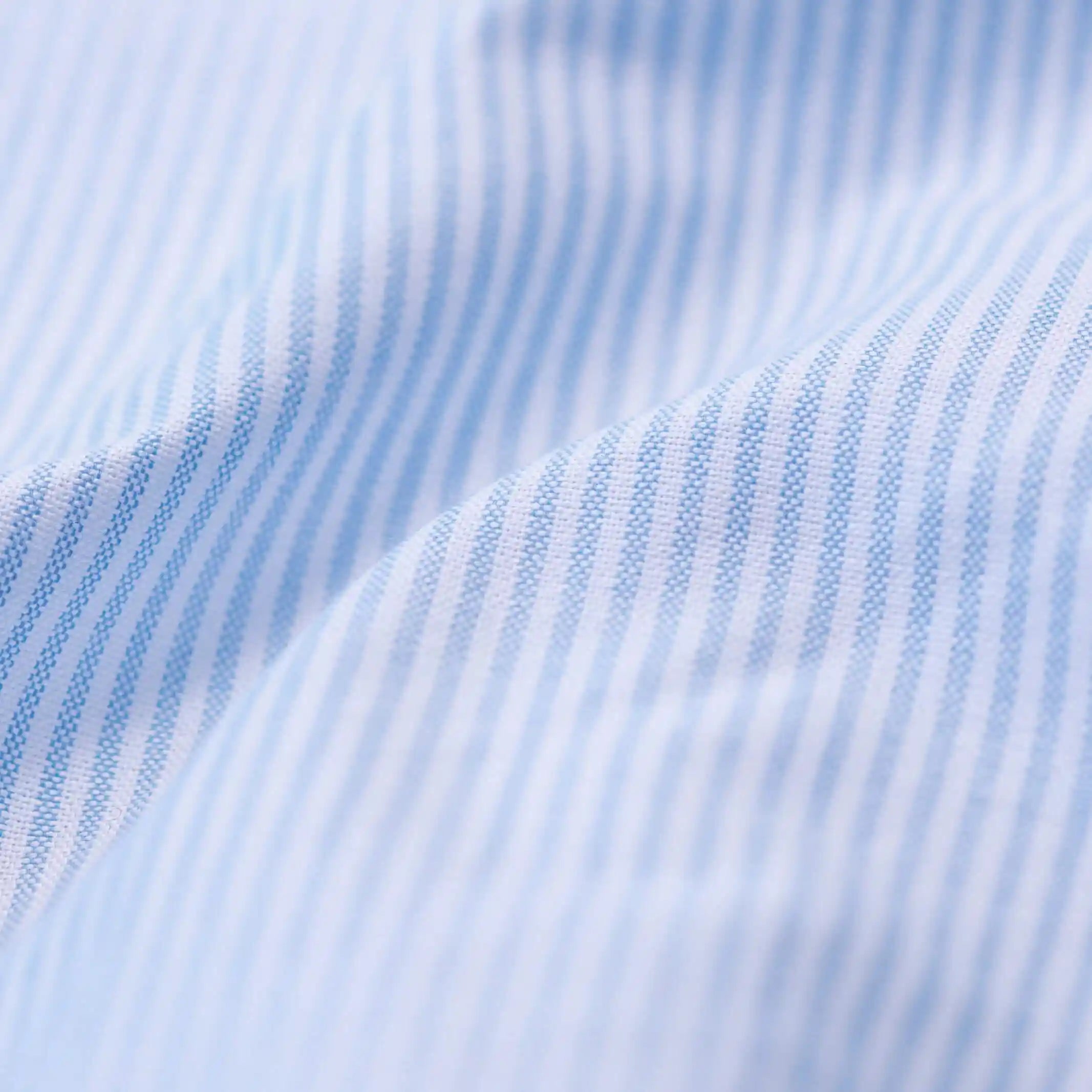 Mayfield oxford stripe shirt fabric close-up showing blue striped weave pattern