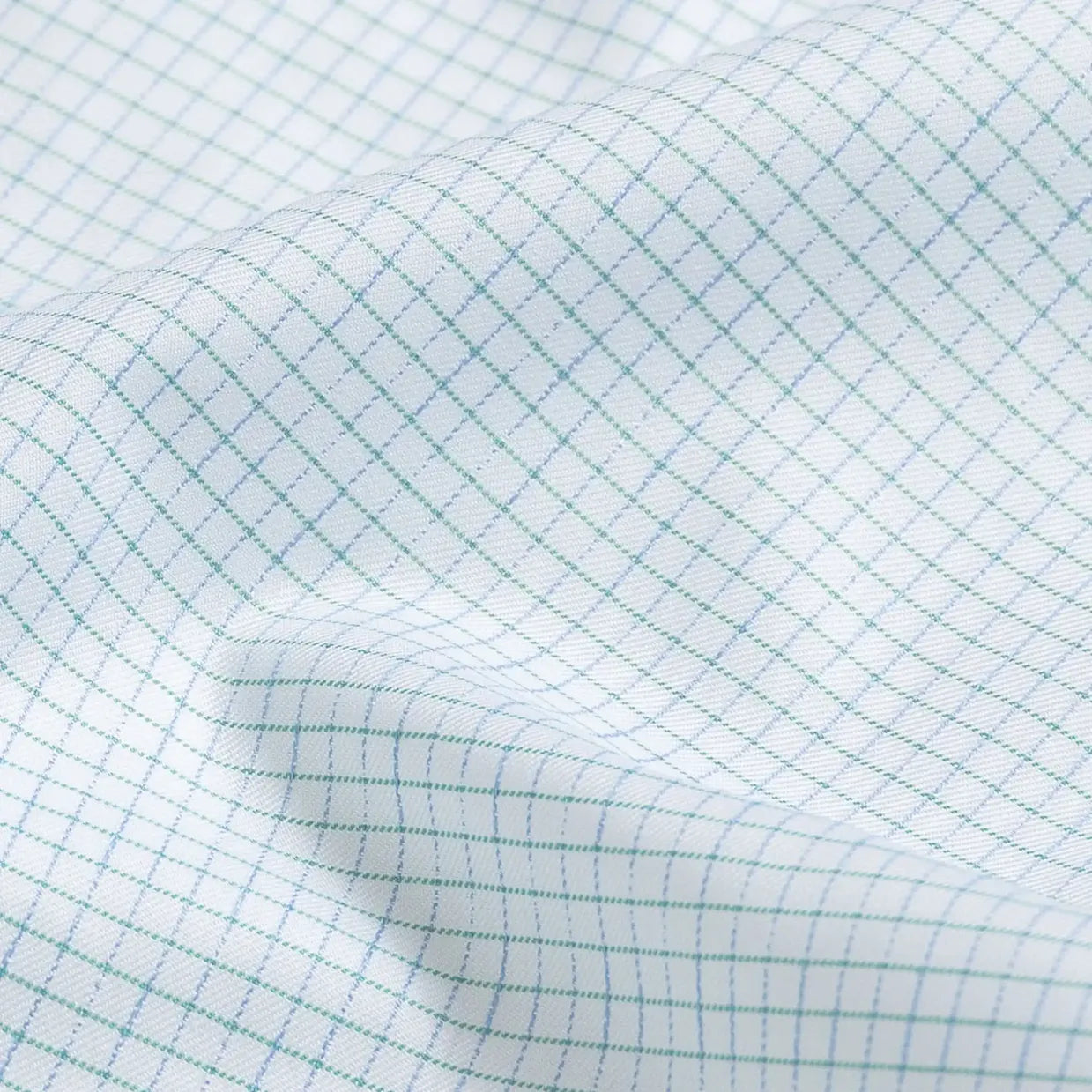 Leaf check fabric close-up - Ledbury Kentland twill with blue and green floating yarns