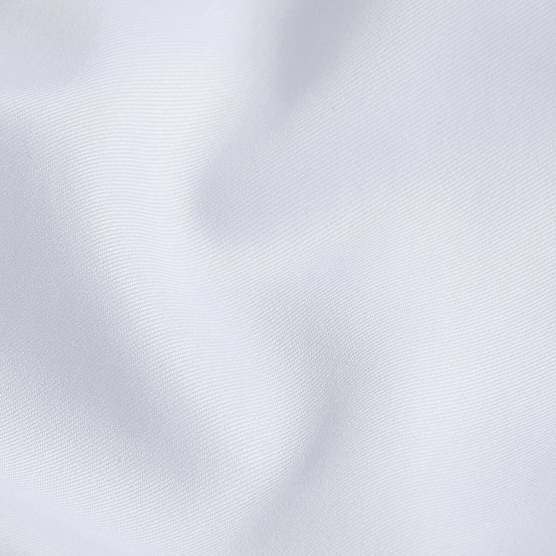Non-iron fine twill fabric close-up - wrinkle-resistant white cotton texture