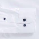 White shirt sleeve with navy button cuff - non-iron custom dress shirt detail