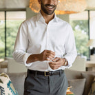 Man wearing white non-iron dress shirt - wrinkle-free custom fit business shirt