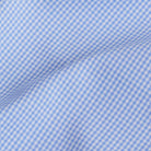 Premium blue micro gingham fabric close-up - subtle luxury dress shirt pattern