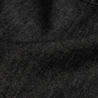 Washed black Slater denim fabric close-up - 100% cotton texture